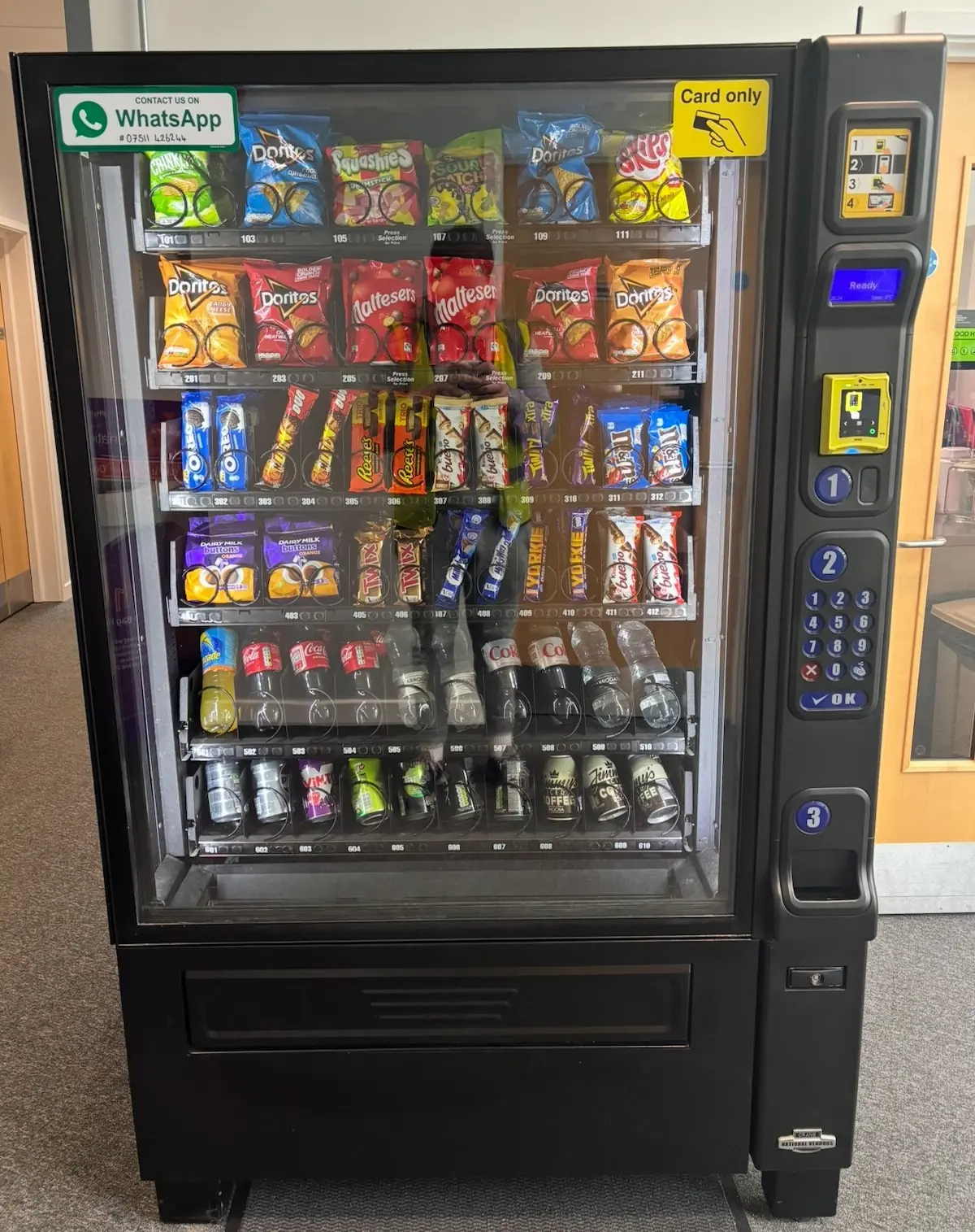 Smart vending machine stocked with snacks and drinks